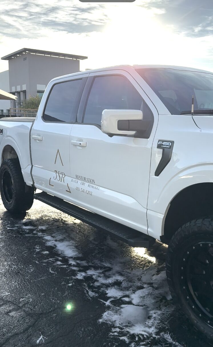 Golden detailing a 3S Restoration work truck in Mesa